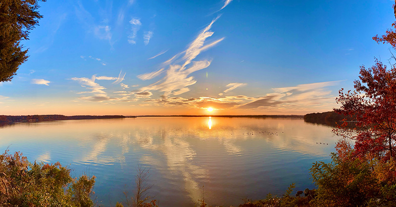 Sun setting over the water.
